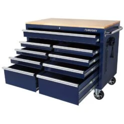 Husky 46 In. W X 24.5 In. D Standard Duty 9-Drawer Mobile Workbench Cabinet With Solid Wood Top In Gloss Blue -Husky Tools Shop gloss blue with silver trim husky mobile workbenches h46mwc9gbv2 a0 1000